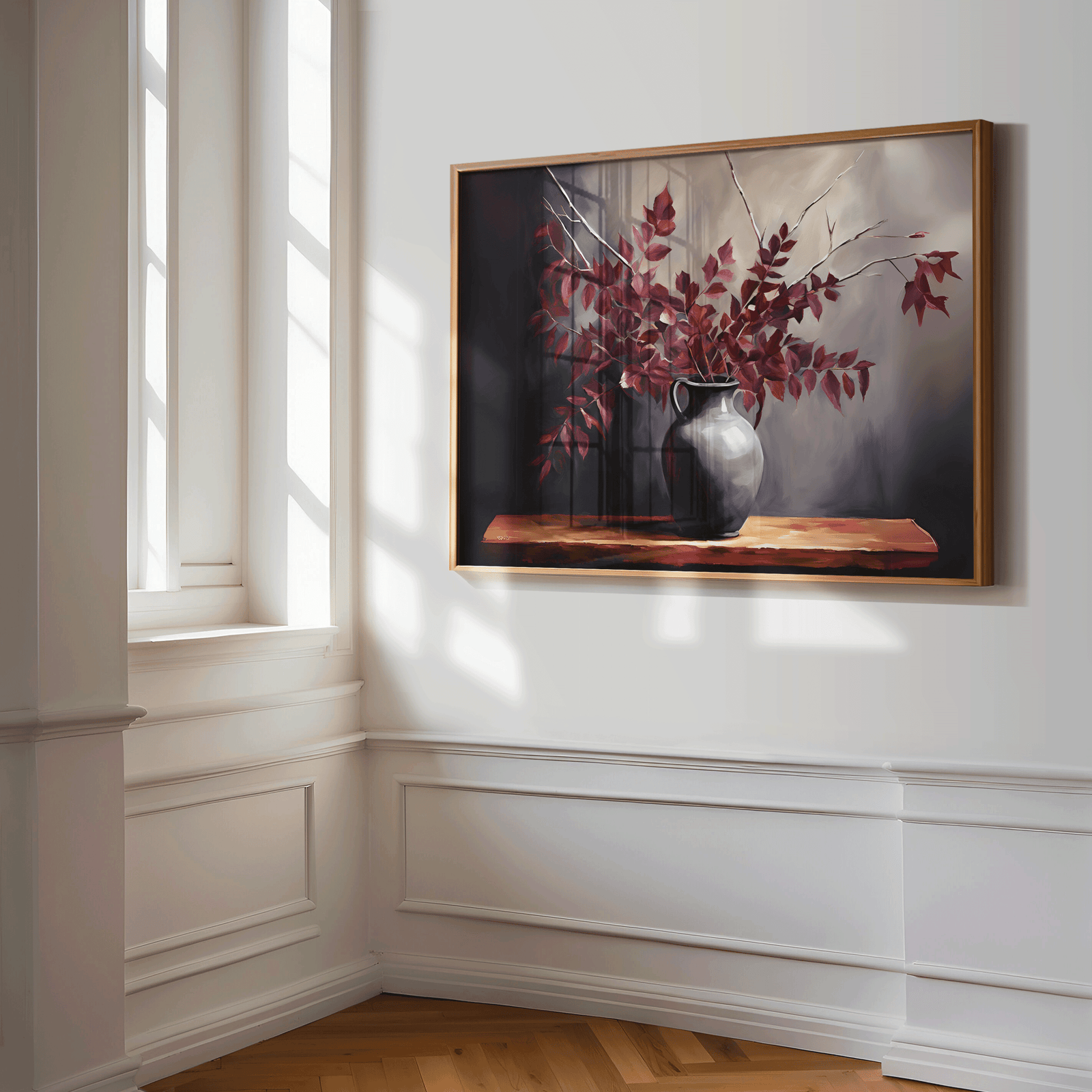 Framed canvas wall art print of a still life vase with burgundy red leaves on a wall in a hallway or entryway with a window.
