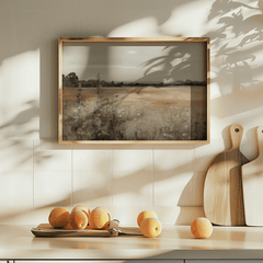 Vintage nature landscape wall art framed canvas styled above kitchen counter with natural light and fruit
