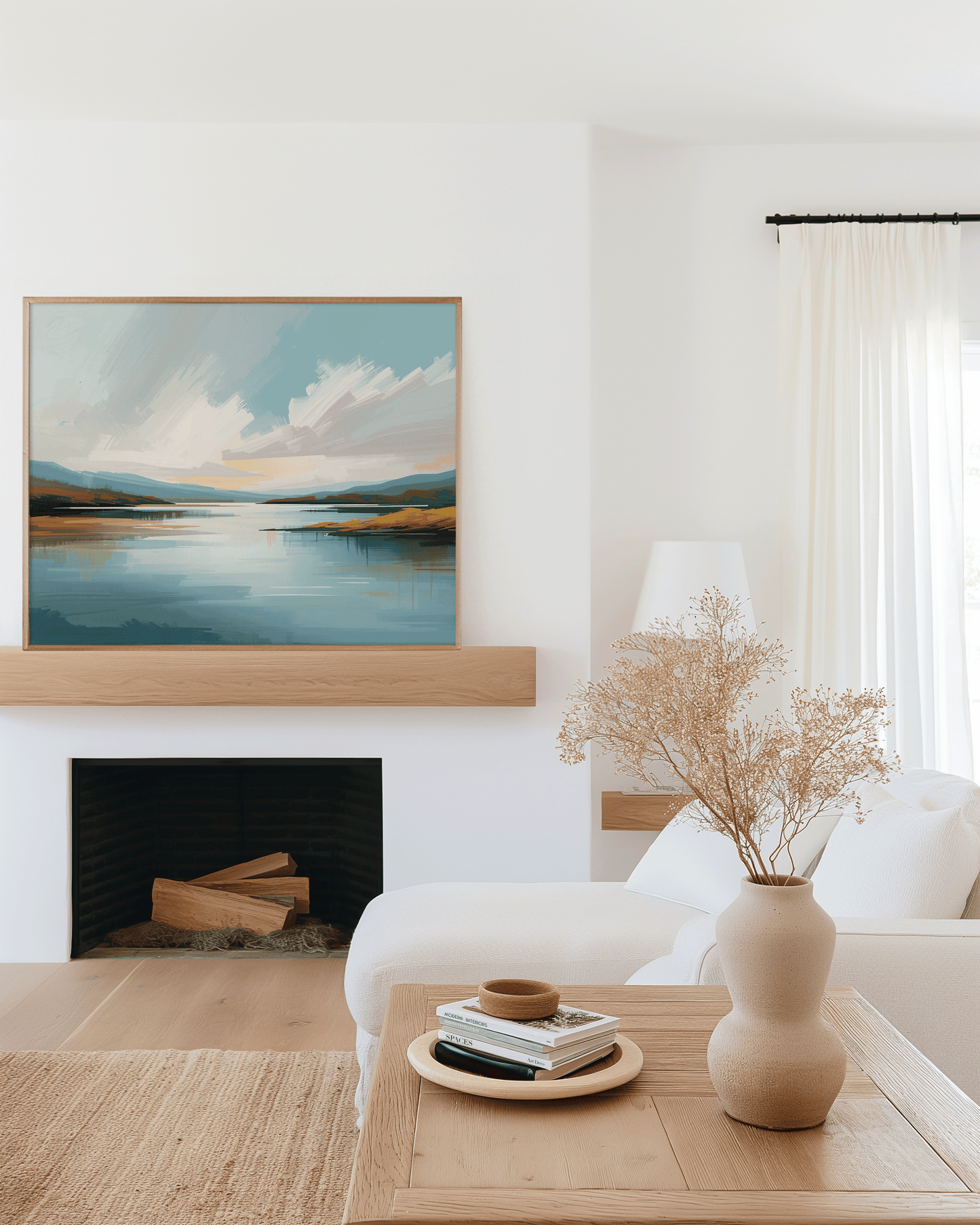 Large blue lake landscape wall art framed above fireplace in modern neutral home