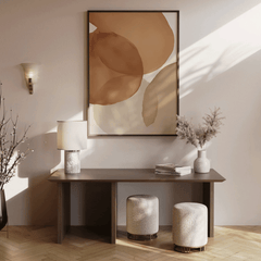 Oversized terracotta watercolor abstract wall art with burnt orange, brown, beige, cream and grey colors over brown wooden console table in warm entryway.