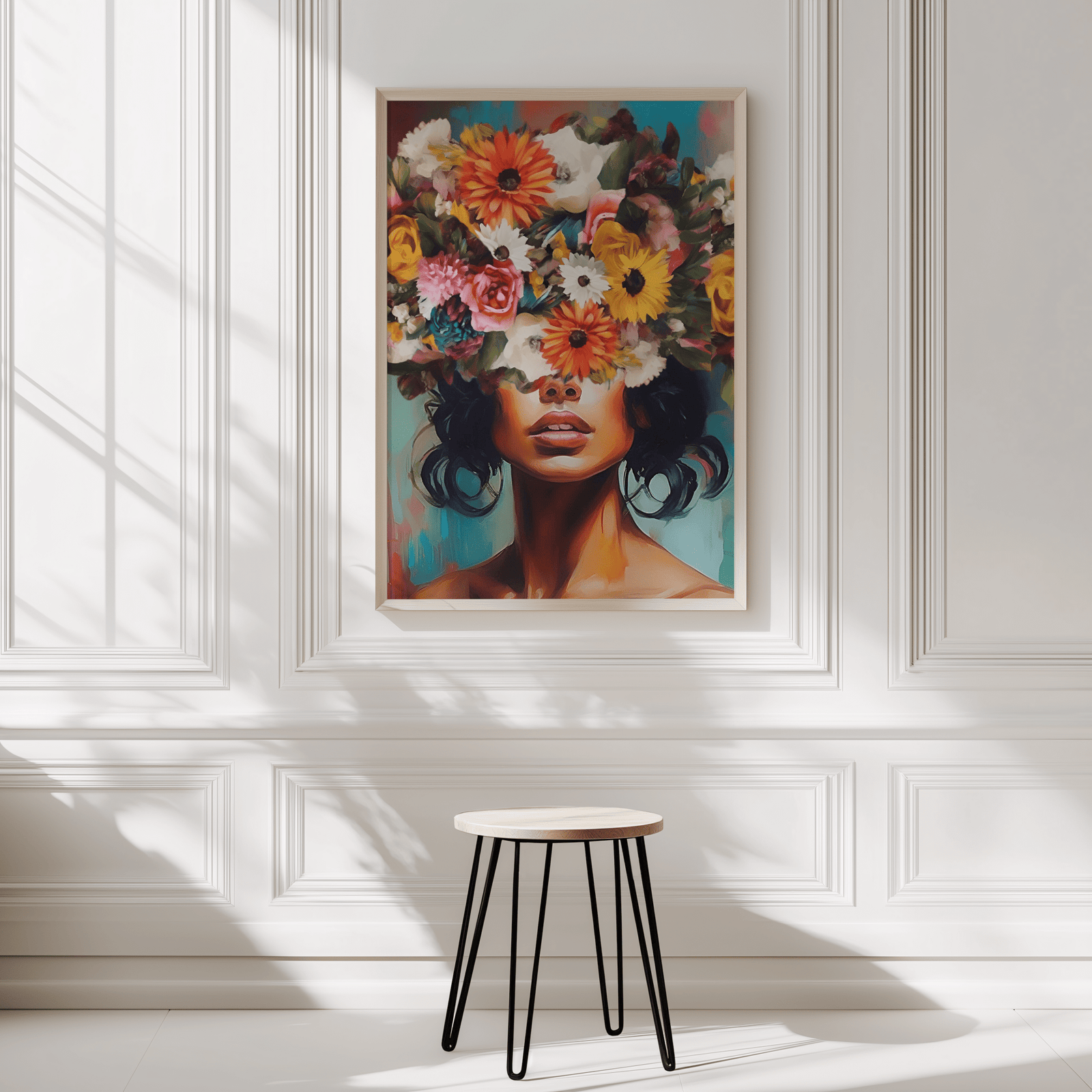 Large colorful floral woman portrait wall art print with flower crown styled on white wall in modern home interior.