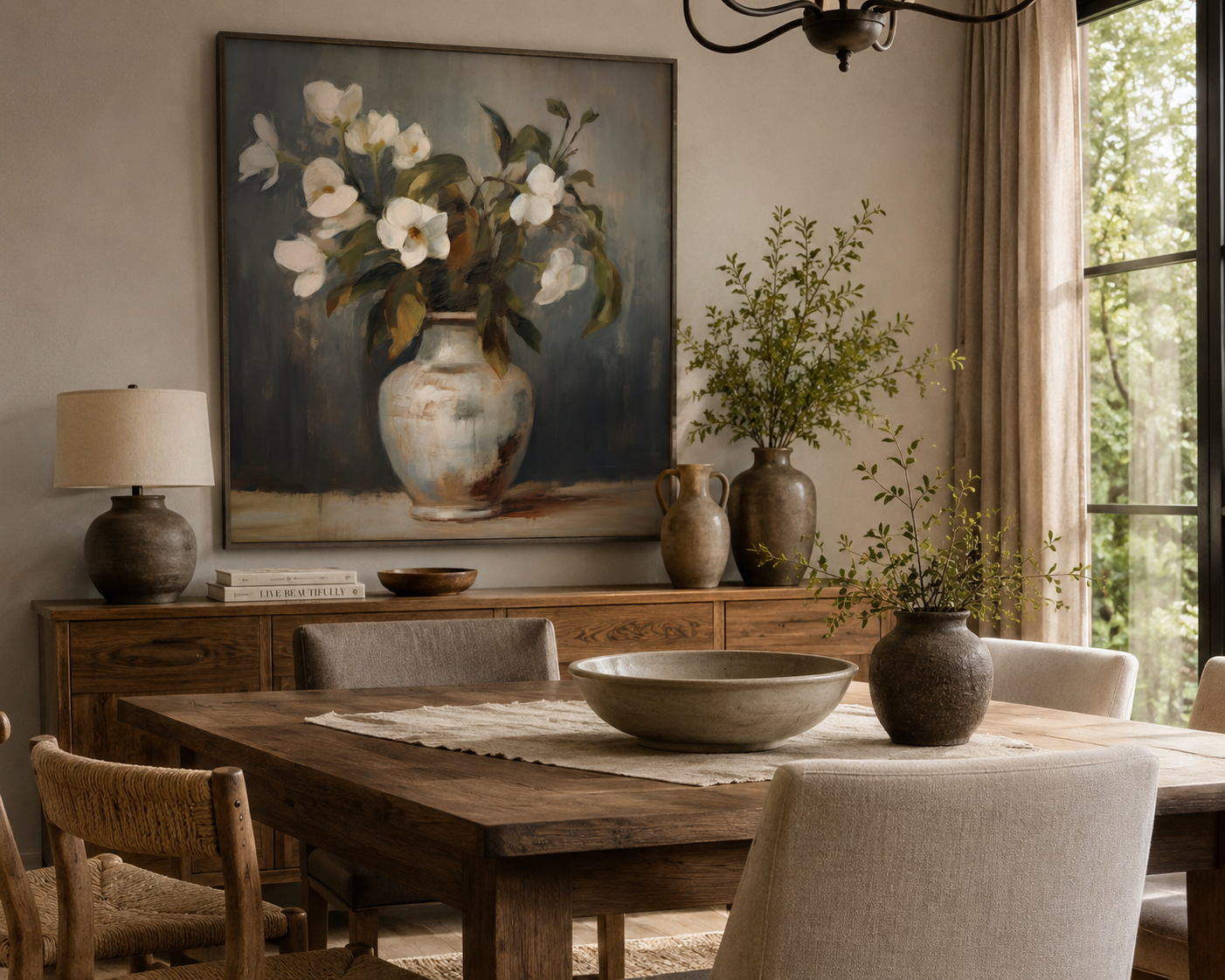 White floral vase wall art displayed in a warm modern dining room above a wood sideboard with neutral furnishings and natural textures.