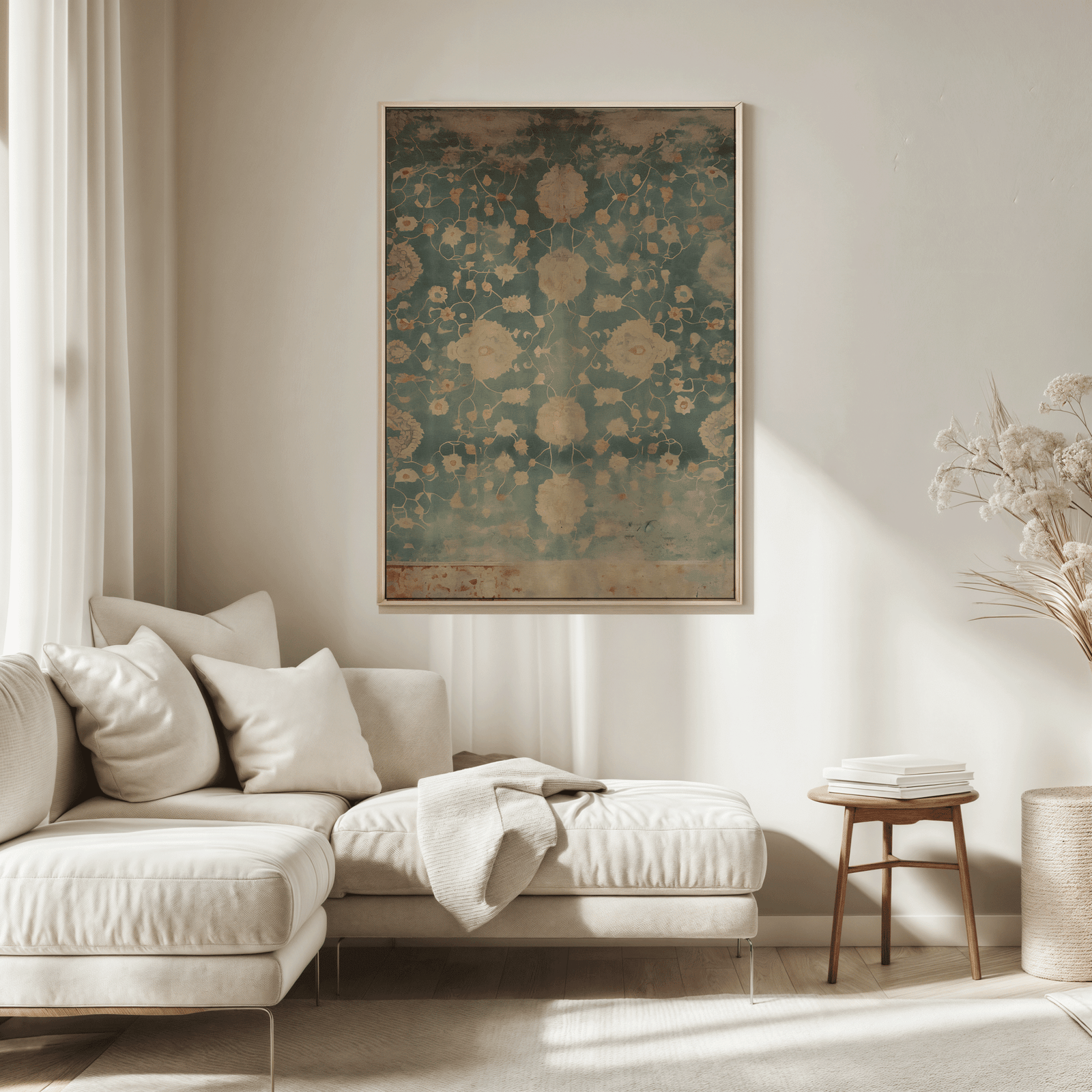 Living room with a beige sofa, decorative pillows, and a large framed blue and beige botanical wall art print