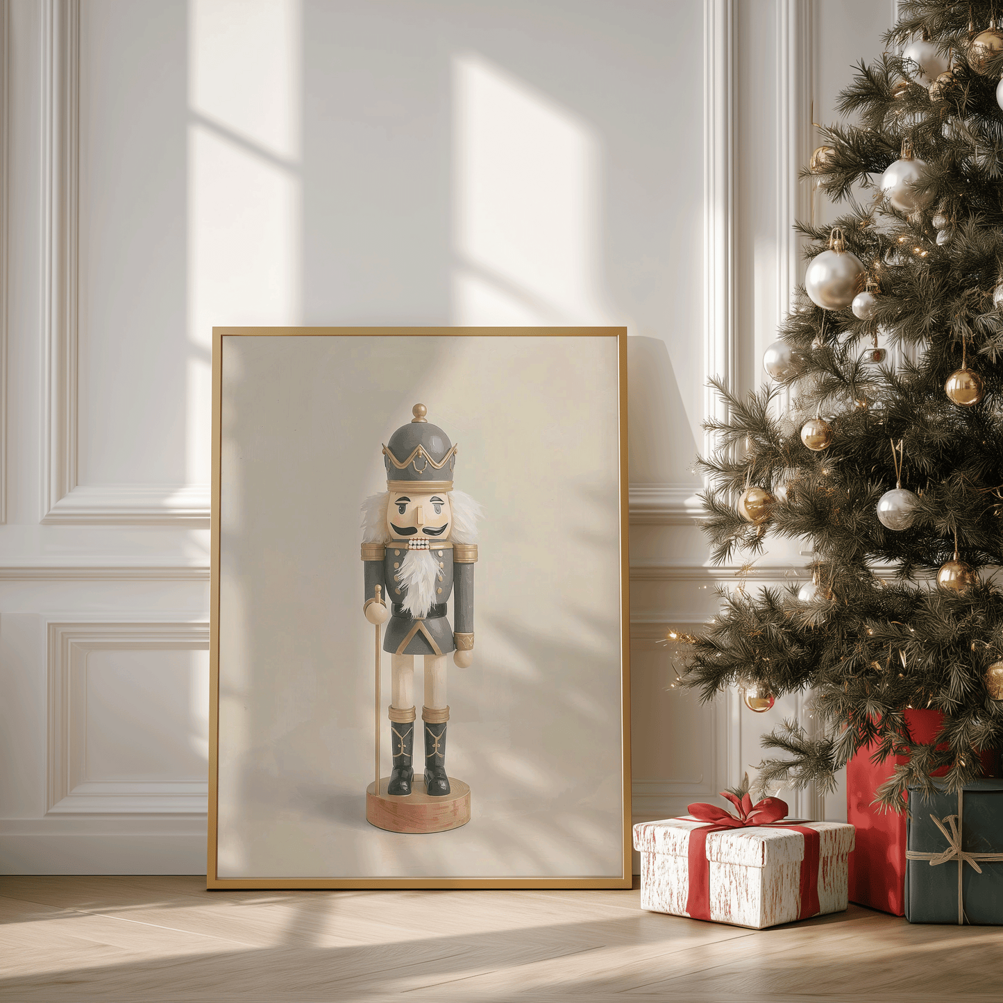 Large framed nutcracker Christmas canvas leaning against a white paneled wall with sunlight casting soft shadows, styled beside a decorated gold-and-white Christmas tree and wrapped red-and-white presents
