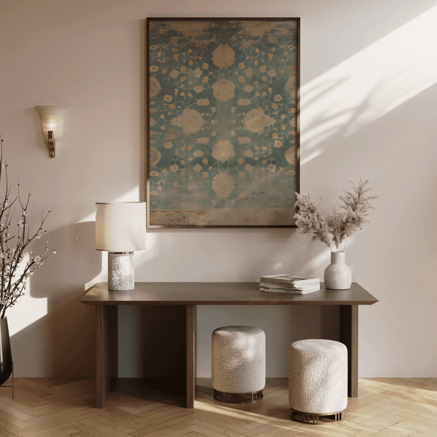 Modern interior with a wooden console table in entryway, lamp, and decorative items against a wall with a floral textile framed wall art print