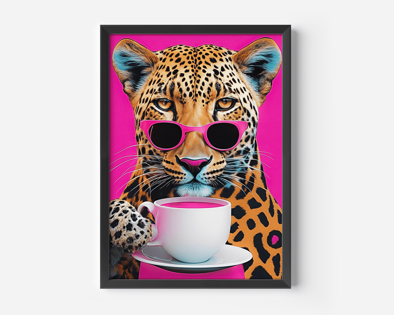 Black framed leopard print wall art above a pink velvet sofa