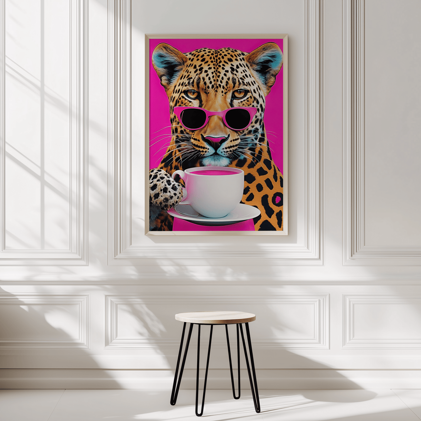 Leopard print wall art in natural frame displayed in a minimalist white panelled room