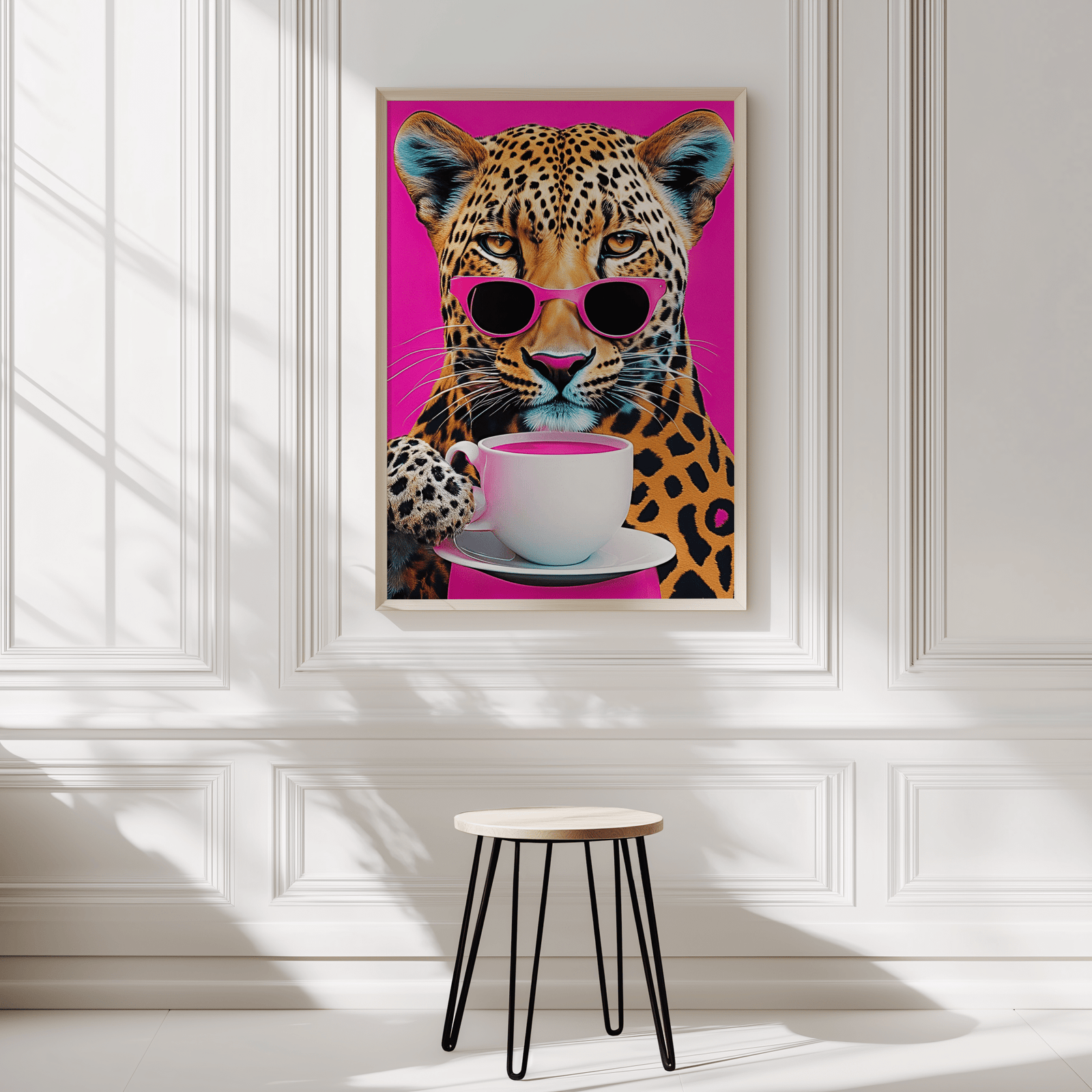 Leopard print wall art in natural frame displayed in a minimalist white panelled room