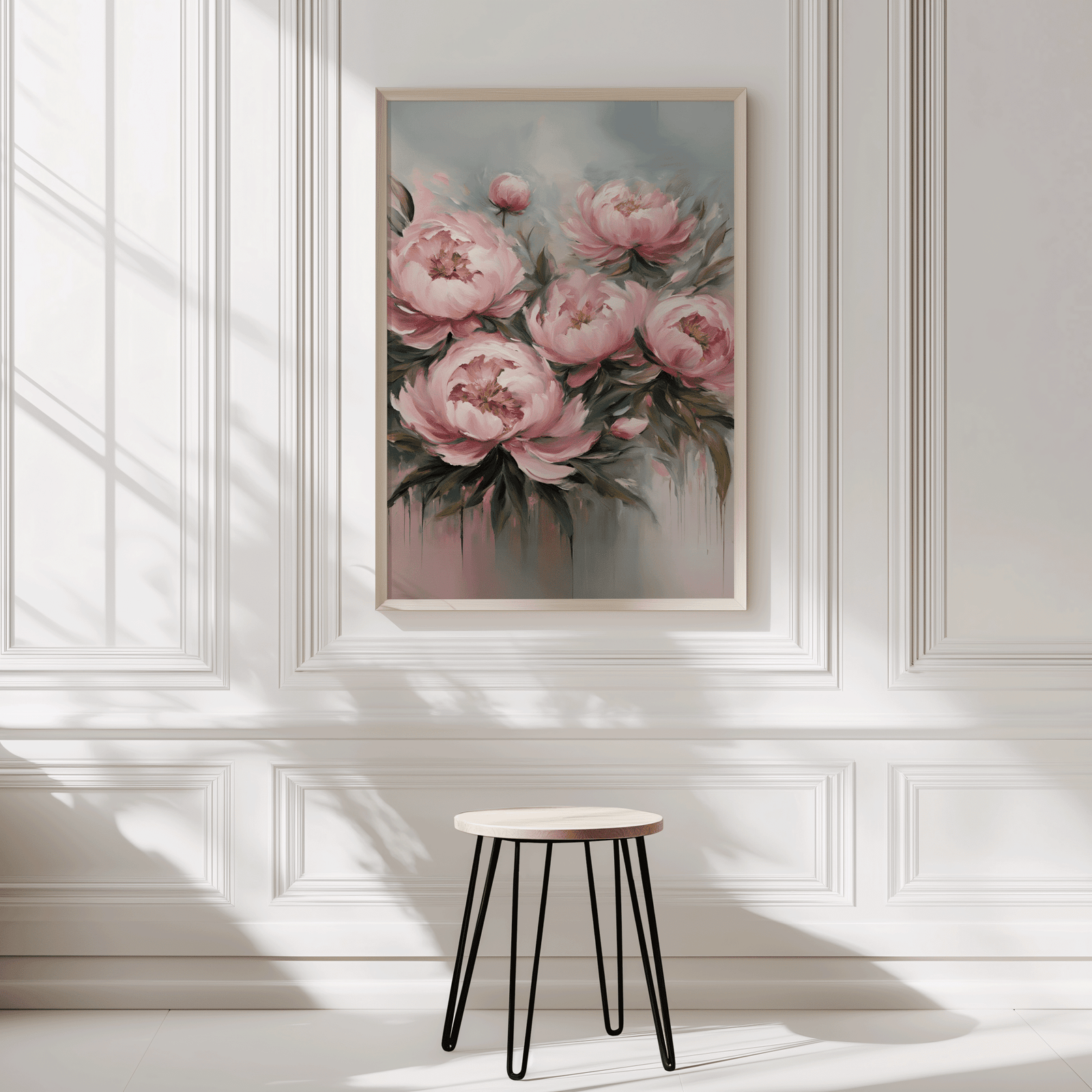 Framed botanical canvas wall art print on a white wall with a small stool below. Soft, romantic floral artwork with light pink, muted green and soft blue colors with a faux texture, oil-like painting effect.