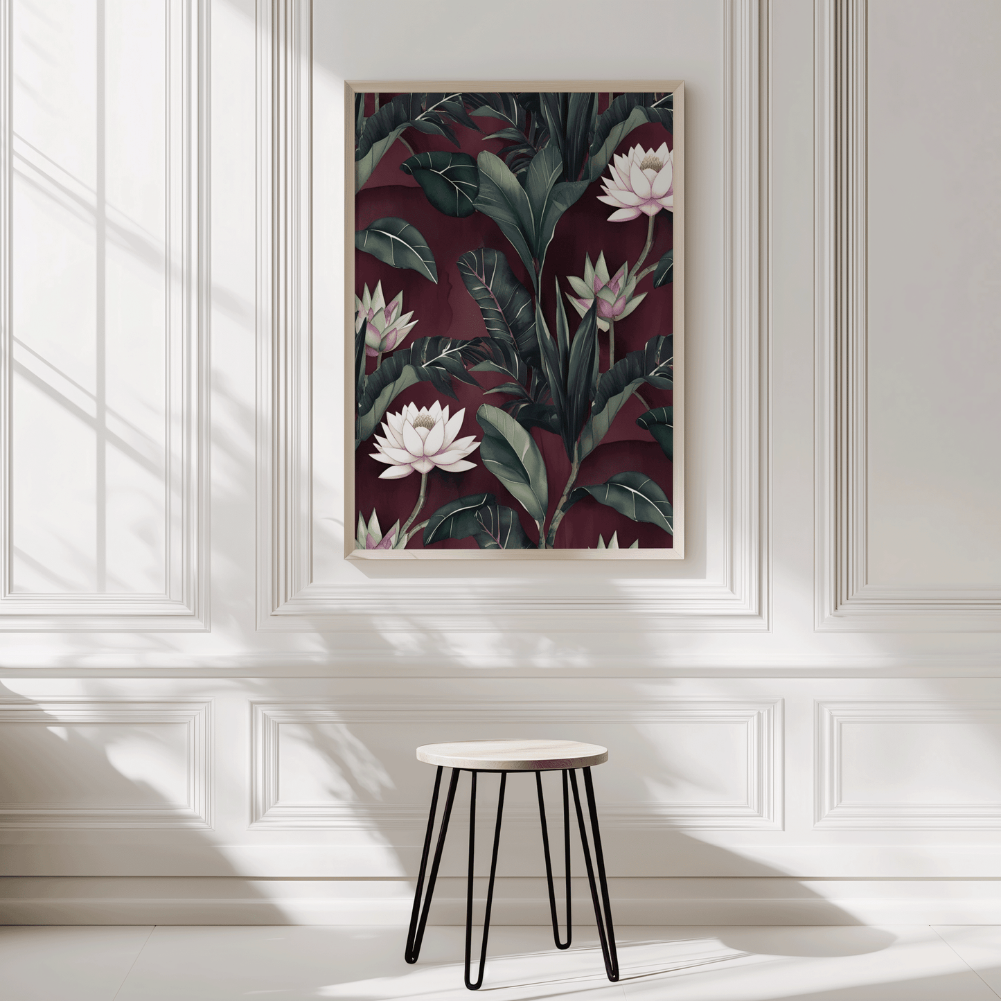 Maroon and burgundy floral lotus wall art in a natural wood frame on a panelled entryway wall
