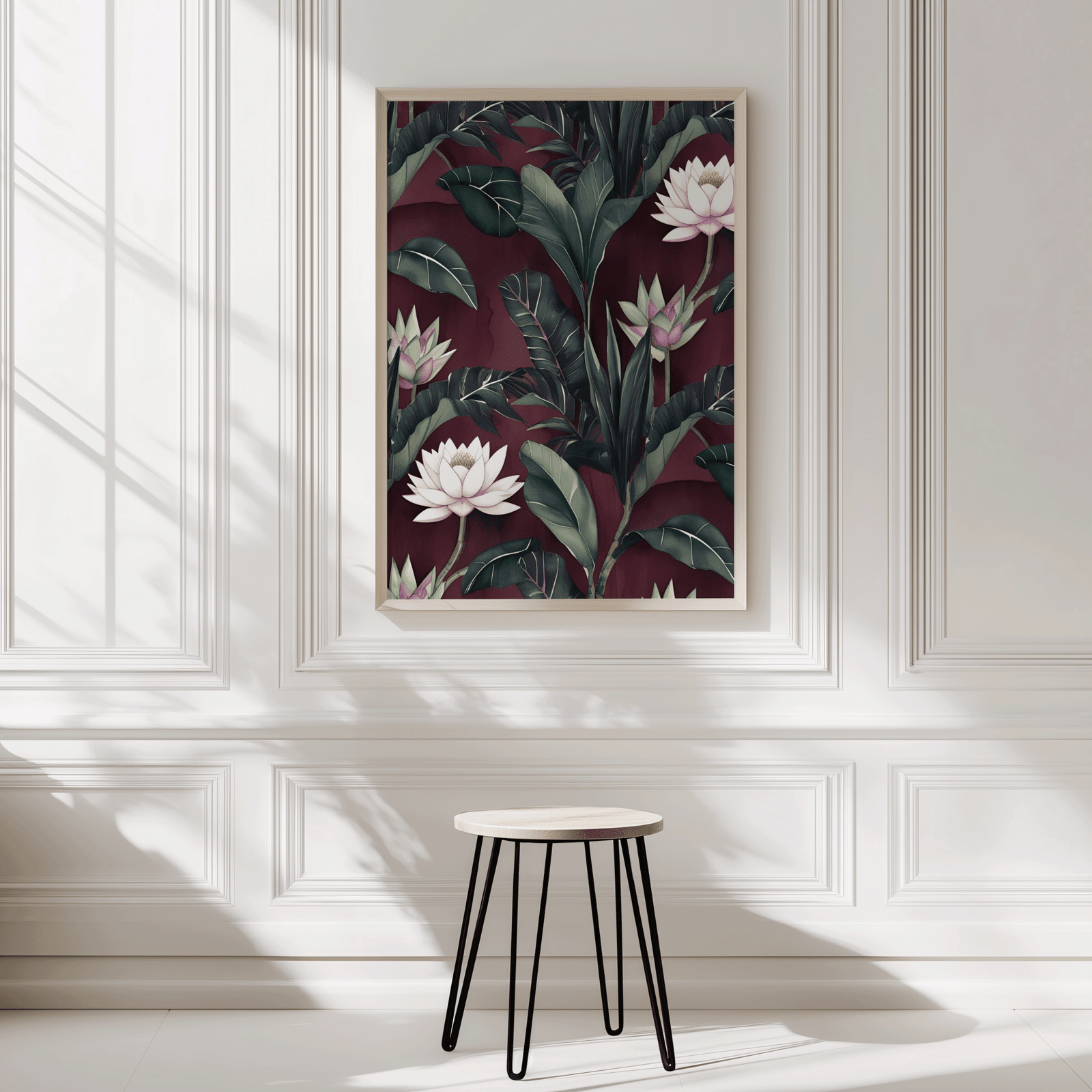 Maroon and burgundy floral lotus wall art in a natural wood frame on a panelled entryway wall