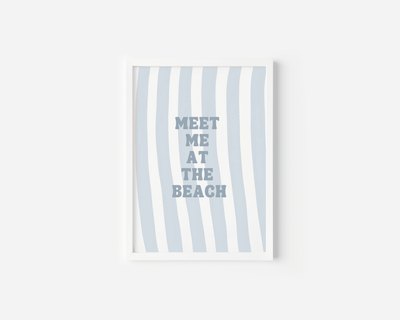 White framed meet me at the beach wall art on a plain white background
