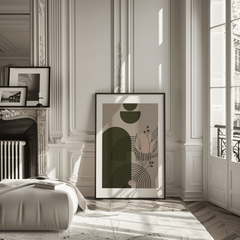 Mid-century botanical geometric art in a black frame leaning in a classic Parisian apartment