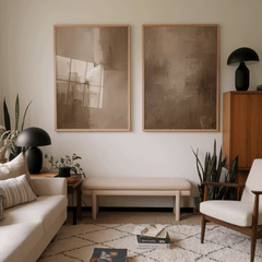 Two large canvas wall art prints with brown and beige hues, in warm neutral abstract design in midcentury modern living room