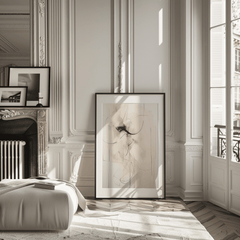 Large framed neutral abstract wall art leaning against wall in living room with beige, cream, brown and minimal lines