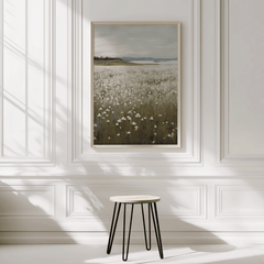 Minimal framed vintage wildflower landscape print in a bright room