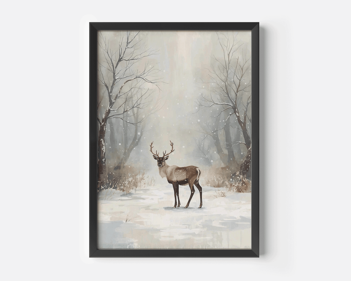 Snowy forest deer wall art in a black frame with bare trees, falling snow and muted beige tones