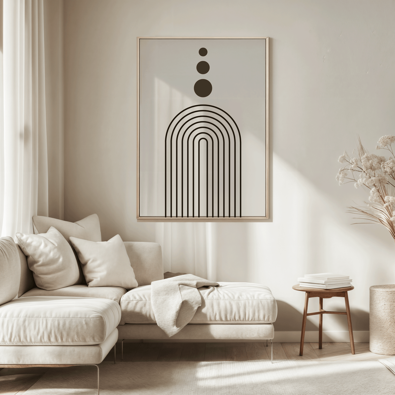 Minimalist arch wall art above a beige sofa in a bright, sunlit living room
