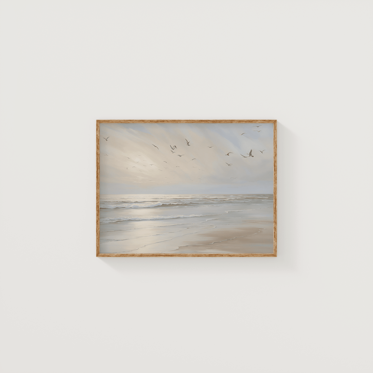 Framed coastal beach wall art featuring calm ocean waves and soft sunlight — neutral beige tones ideal for modern coastal home decor