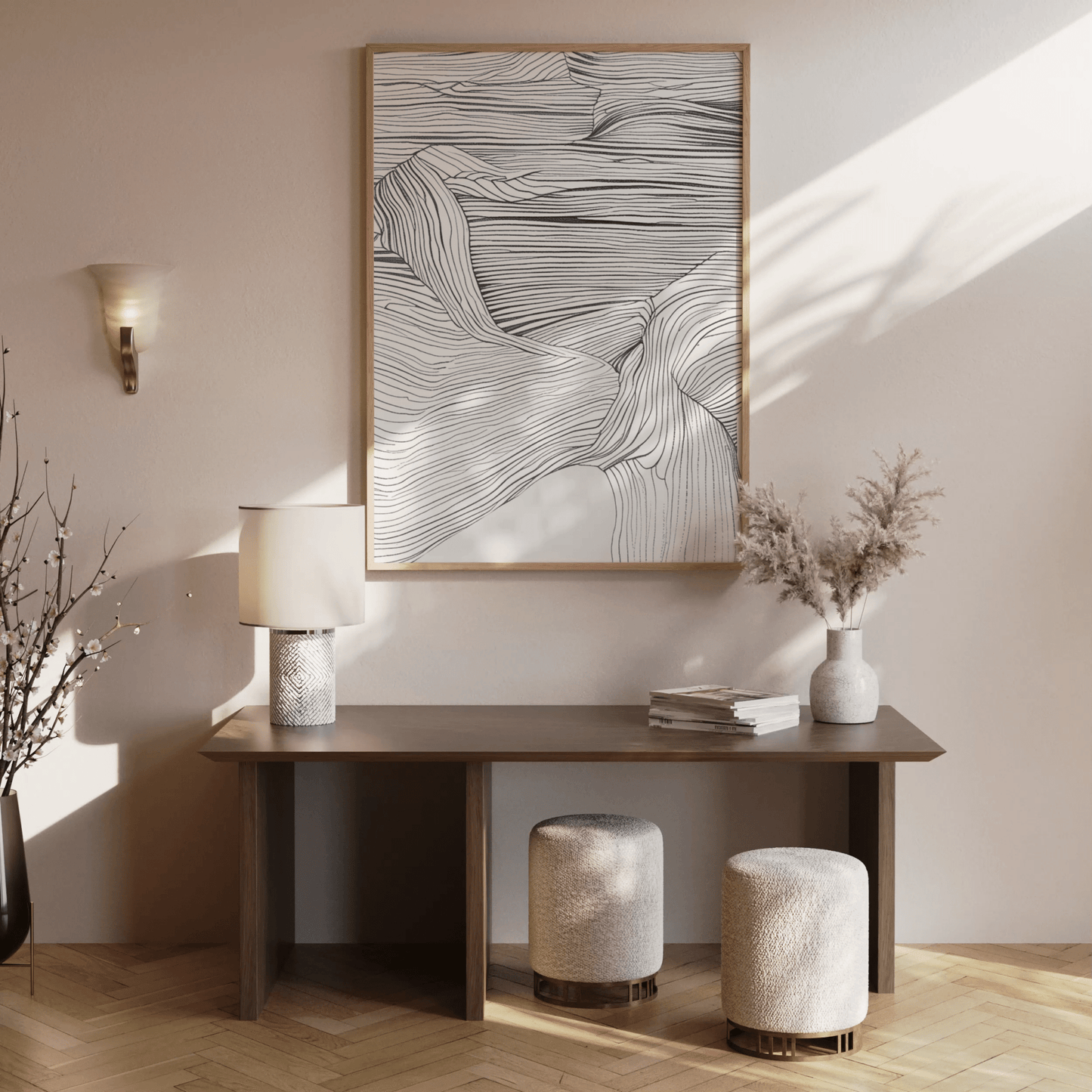 Modern abstract line art print in black & white mounted above a console table in a minimalist entryway or hallway.