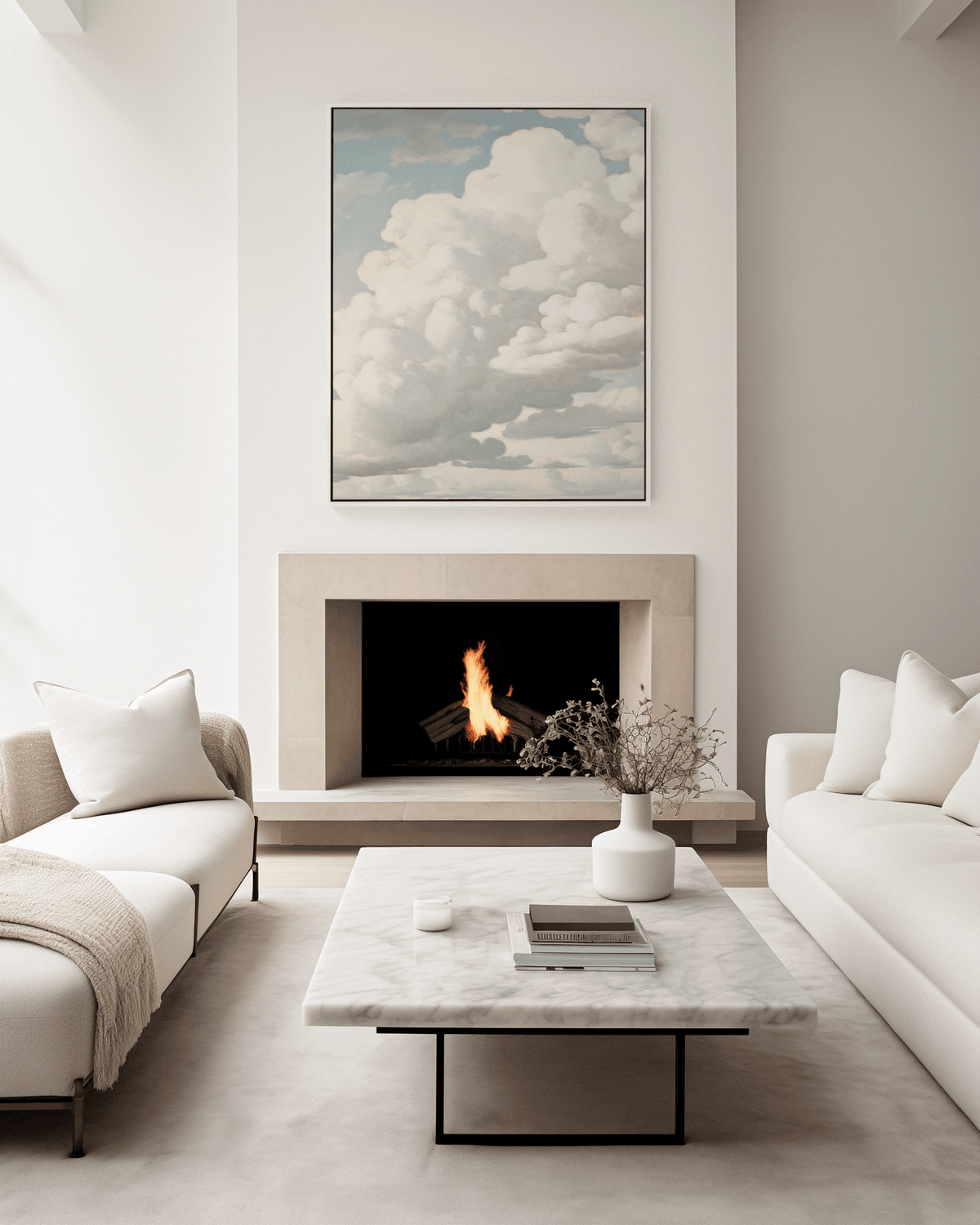 Modern living room white sofas, and a large cloudscape and blue skies framed wall art print above fireplace.