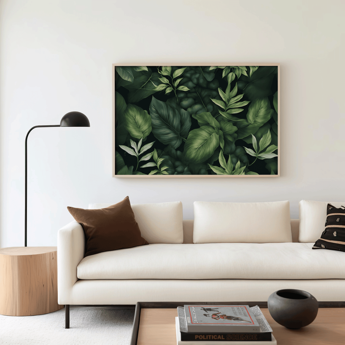 Moody botanical wall art in a natural frame above a cream sofa with a floor lamp