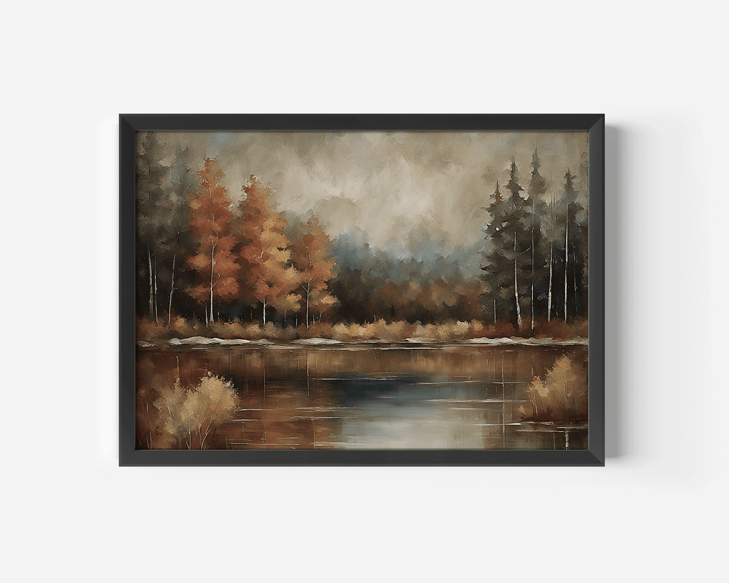 Moody fall landscape wall art in black frame featuring an autumn tree line over still water