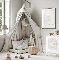 Mother and baby print above a canopy reading nook in a neutral nursery