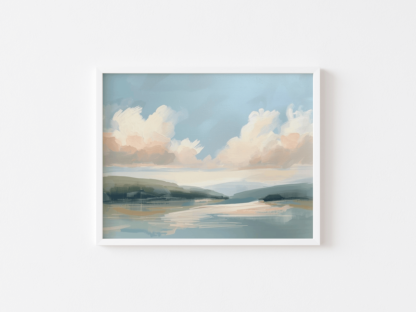 Nature coastal landscape wall art with a white frame, clouds and water on a white wall