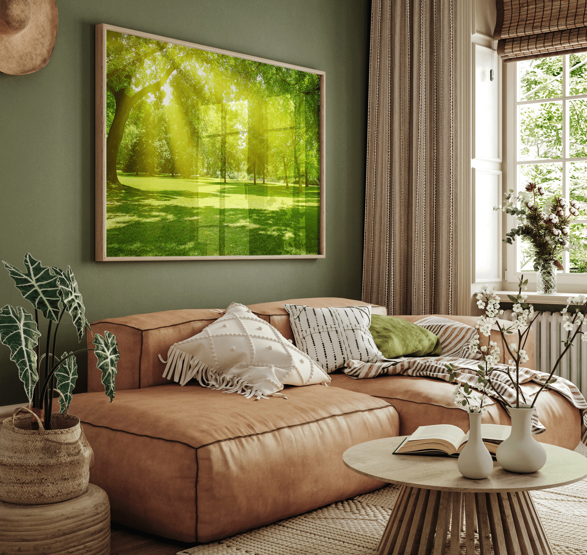 Large nature wall art with glowing sunlight streaming through green forest trees, styled above tan sectional sofa in warm boho modern living room with earthy decor and indoor plants