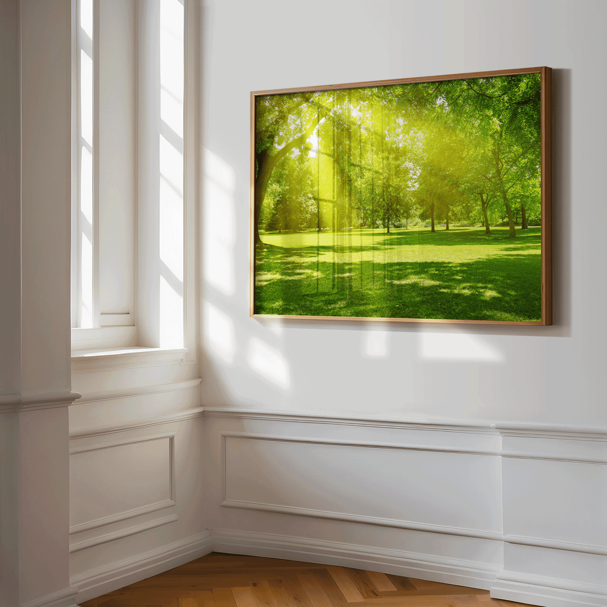 Sun-drenched tree and meadow wall print hanging in elegant corner space with classic molding and natural light, bright green forest art for peaceful interior styling