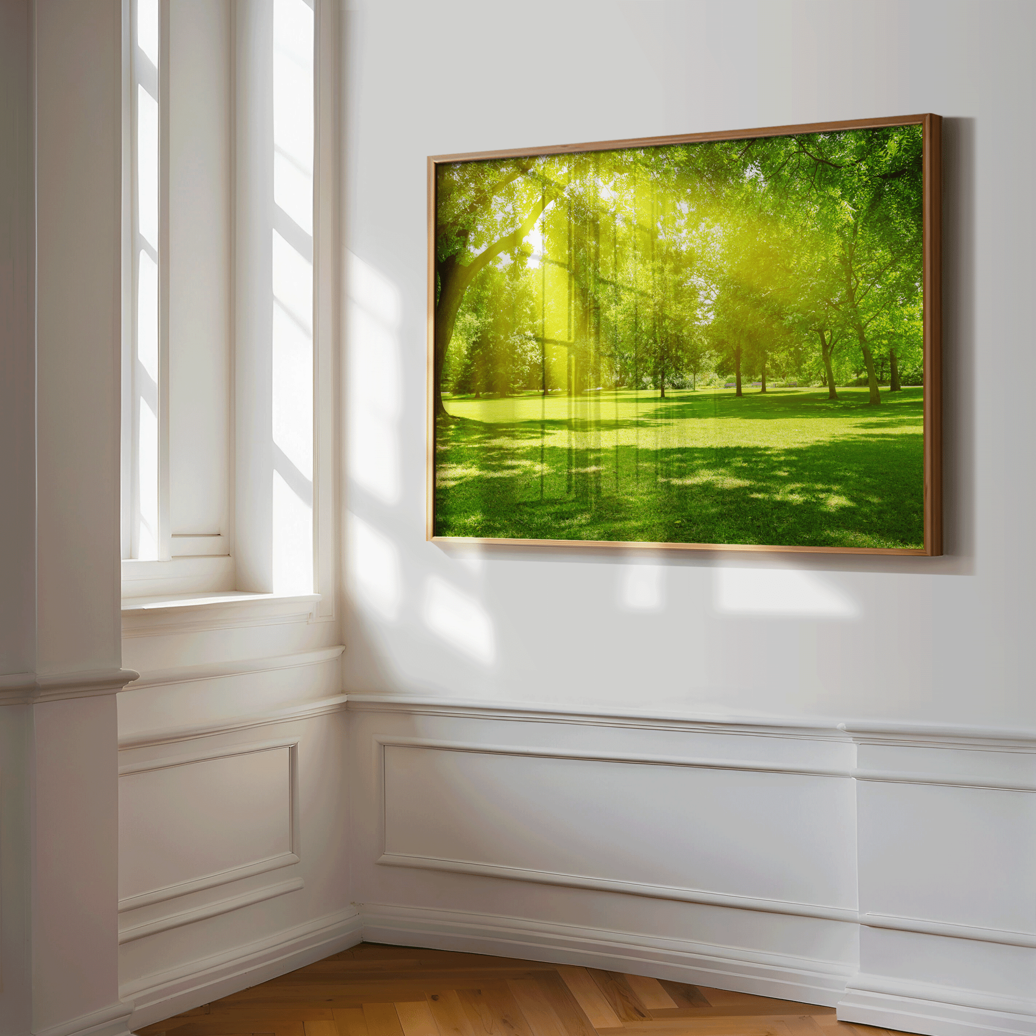 Sun-drenched tree and meadow wall print hanging in elegant corner space with classic molding and natural light, bright green forest art for peaceful interior styling