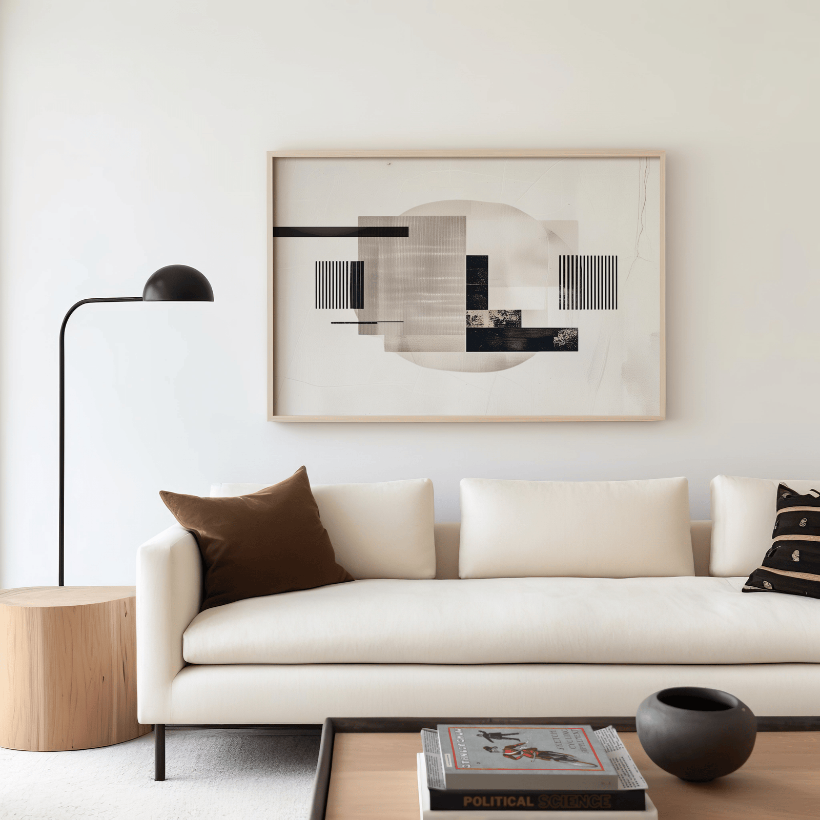 Mid-century modern abstract canvas wall art above neutral sofa – beige and black geometric design
