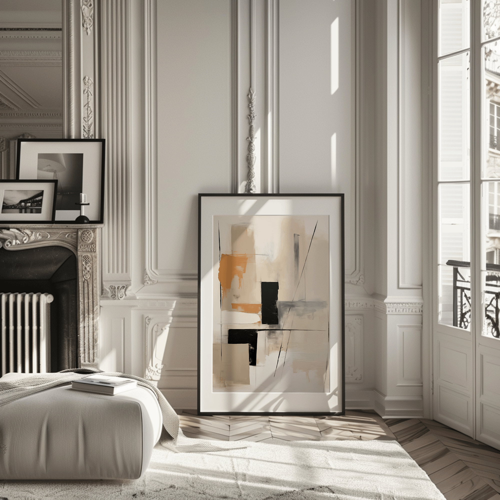 Neutral abstract wall art with tan, camel and black geometric blocks leaning against a wall in a Paris-style living room apartment.