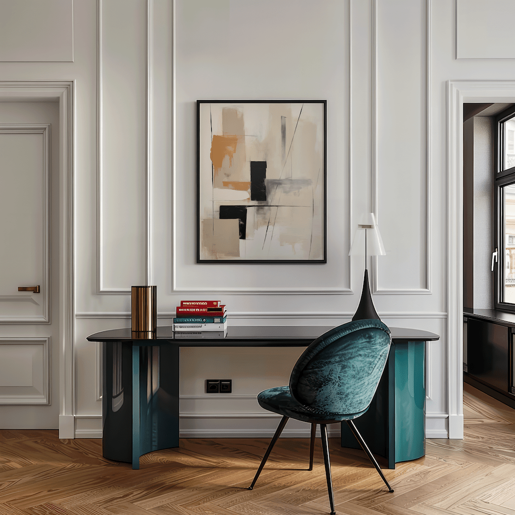Tan and black geometric abstract wall art in a black frame styled above a contemporary desk with a teal chair in a home office.