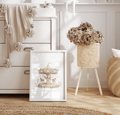 Neutral nursery with blush pink and dusty rose accent colours and dried flowers, featuring a vintage carousel wall art print with butterflies in a white frame