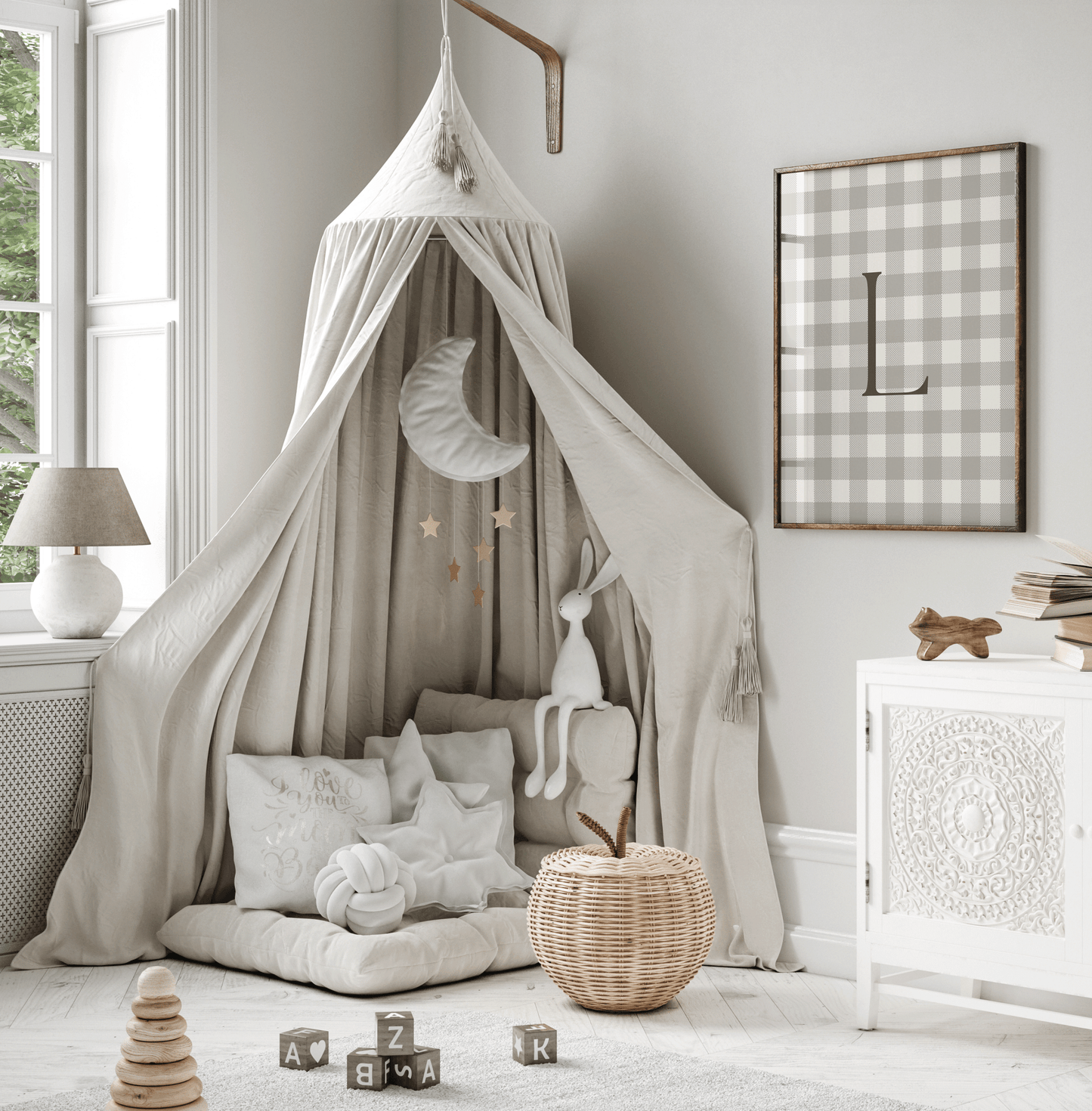 framed gingham letter L framed wall art hung in soft neutral reading nook with canopy, preppy boy nursery decor