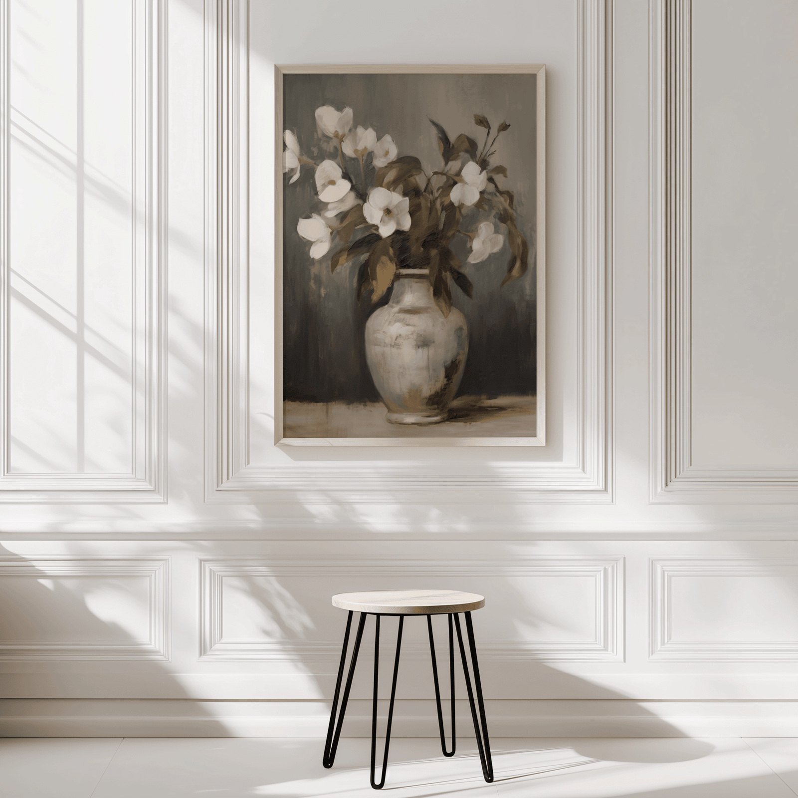 Neutral vintage floral wall art framed on minimal white wall with soft natural light and a stool