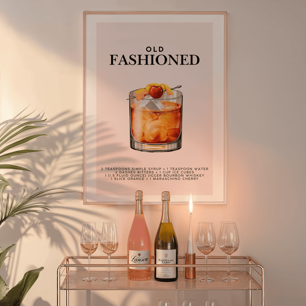 Old Fashioned wall art in a natural frame above a glass bar cart with wine bottles and a candle