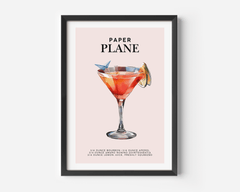 Paper Plane cocktail print with a coral coupe cocktail and the recipe on blush pink in a black frame