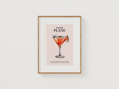 Paper Plane cocktail print in a small natural wood frame on a white background