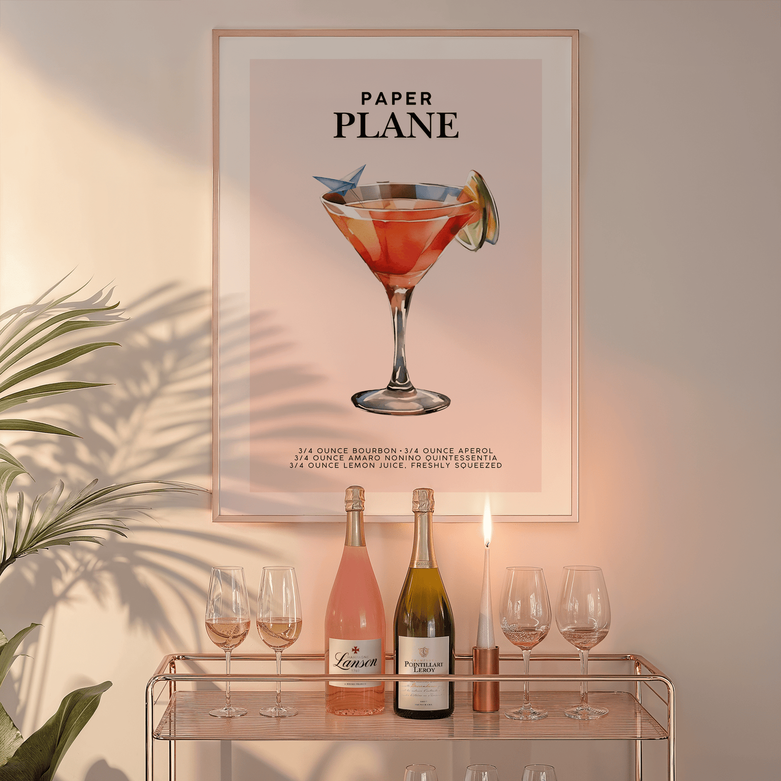 Paper Plane wall art in a natural frame above a glass bar cart with wine bottles and a candle