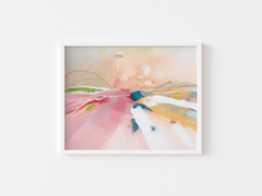 Pastel abstract landscape wall art in a white frame, with blush pink and peach hills and strokes of blue, yellow and green