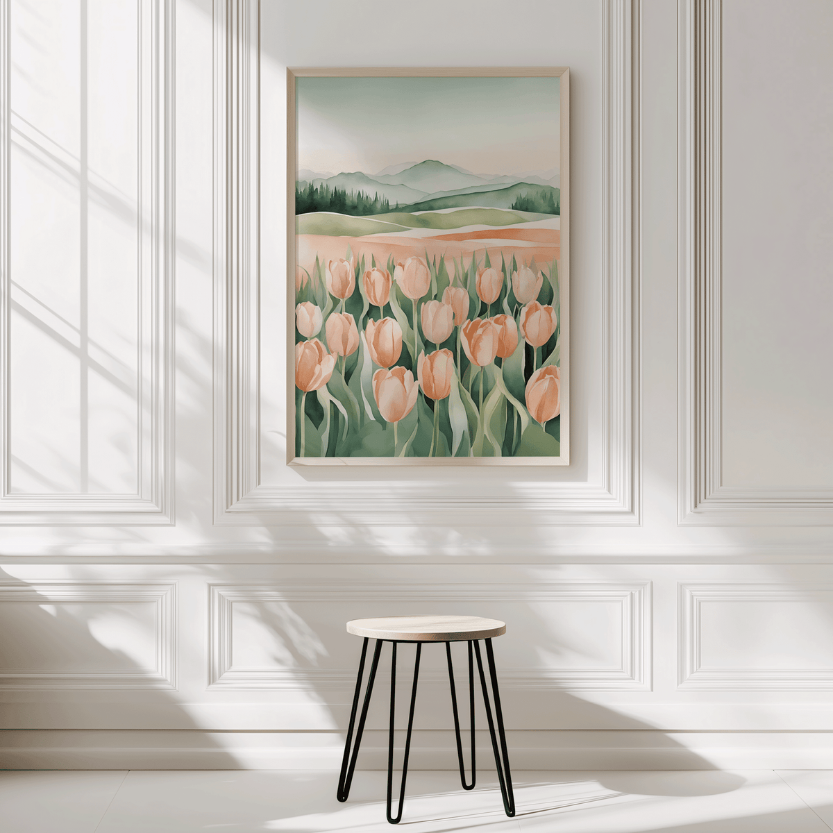 Peach tulip print in a natural frame on a white panelled wall above a black stool