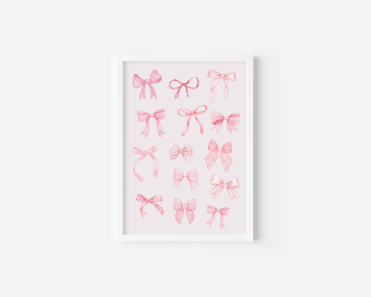 A white framed canvas wall art print featuring watercolor illustrations of various pink coquette bows in different styles, displayed against a white wall.