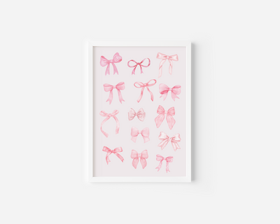 A white framed canvas wall art print featuring watercolor illustrations of various pink coquette bows in different styles, displayed against a white wall.