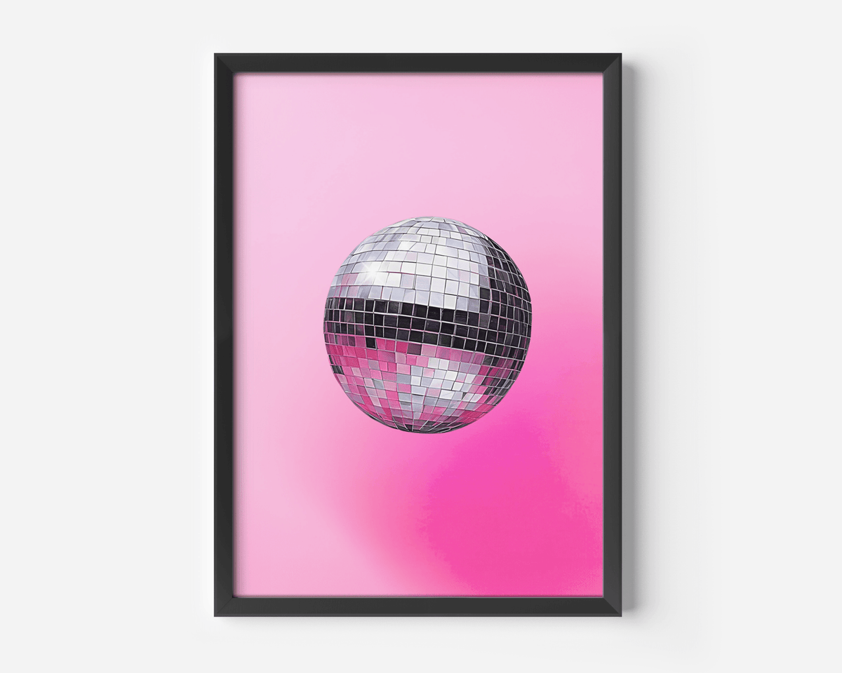 Pink disco ball wall art with a silver mirror ball in a black frame