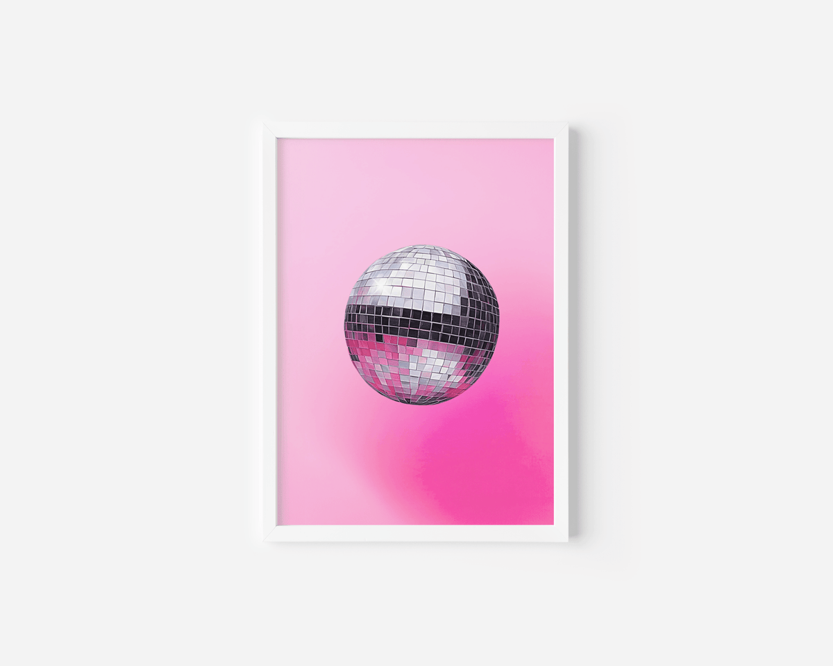 Pink disco ball wall art with a silver mirror ball on a hot pink gradient in a white frame