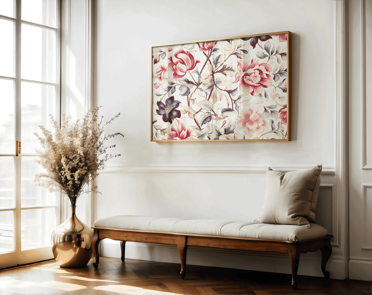 Pink and plum floral wall art in a natural frame above a wooden bench with dried flowers
