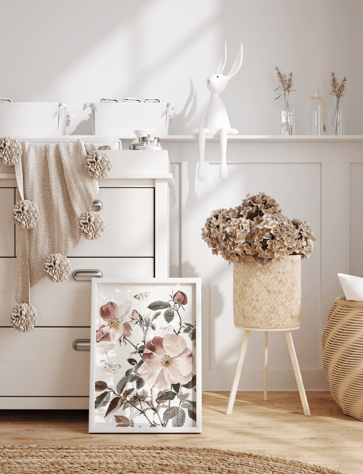 Pink rose print leaning on a nursery dresser with dried flowers and a teddy bear
